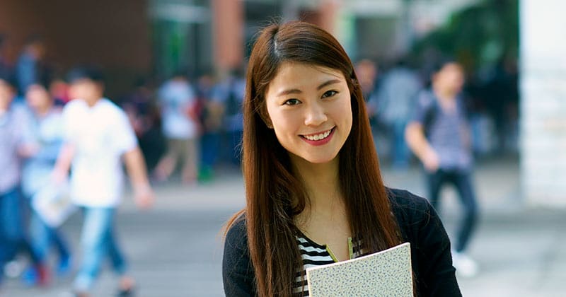 Smiling MBA graduate